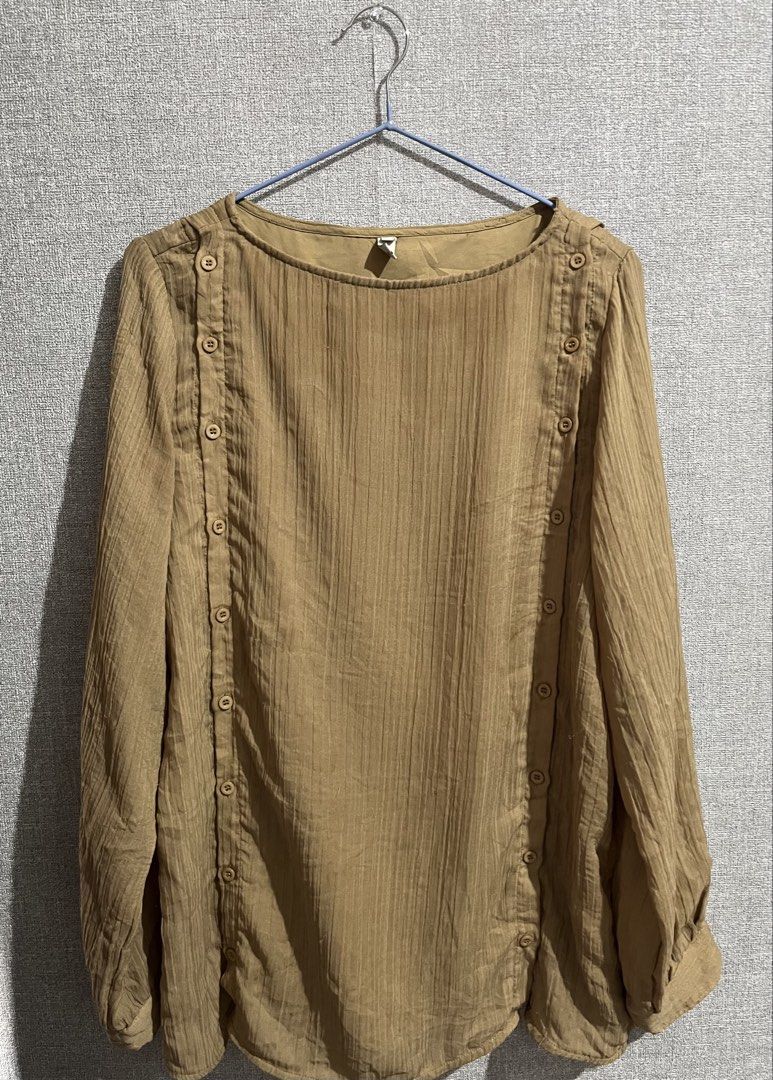 Brown Long Sleeve Blouse with Button Detail (Category: Blouses) located in Marikina City. Submitted by femmeshoppemnl (Listing ID 1462942039, Image 2). Description: Brown Long Sleeve Blouse with Button Detail Size: Small on tag but can fit up to L-XL Condition: Used. Has back to back working buttons Issue: Minimal lints Brand: Lit e Mode Ukay sourced. Washed - Ready to wear. .