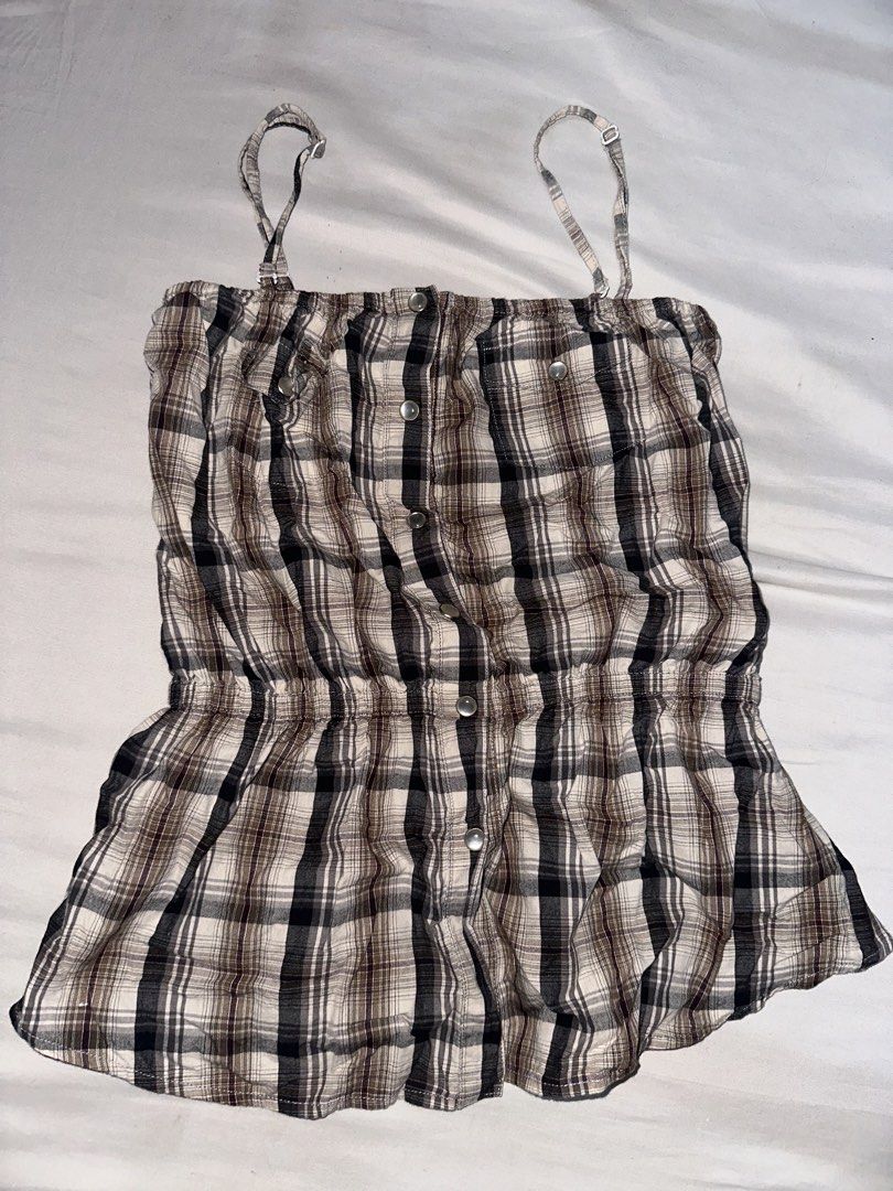 Brown Plaid Button-Up Camisole Top (Category: Sleeveless) located in Manila. Submitted by etain.xo (Listing ID 1463027710, Image 1). Description: - Cute brown plaid camisole top - Adjustable straps and removable straps - Button-up front - Elasticated waist for a flattering silhouette - Lightweight fabric, perfect for layering or wearing alone - Ideal for a casual, chic look - fits small.