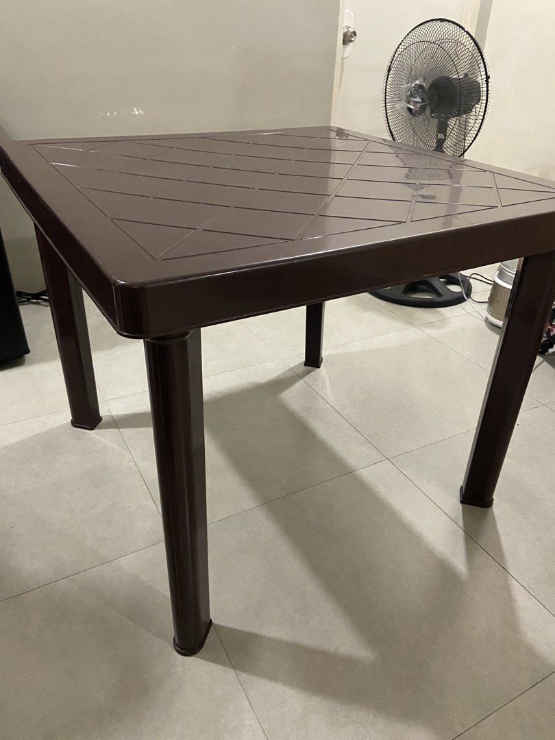 MOVING OUT: Brown Plastic Square Table with Detachable Legs (Category: Tables & Sets) located in Los Banos. Submitted by chieme.011 (Listing ID 1463084760, Image 1). Description: Material: Sturdy brown plastic table Pattern: Square top with diamond pattern • Detachable legs for easy storage and transport • Versatile: great for dining, study, or as a side table.