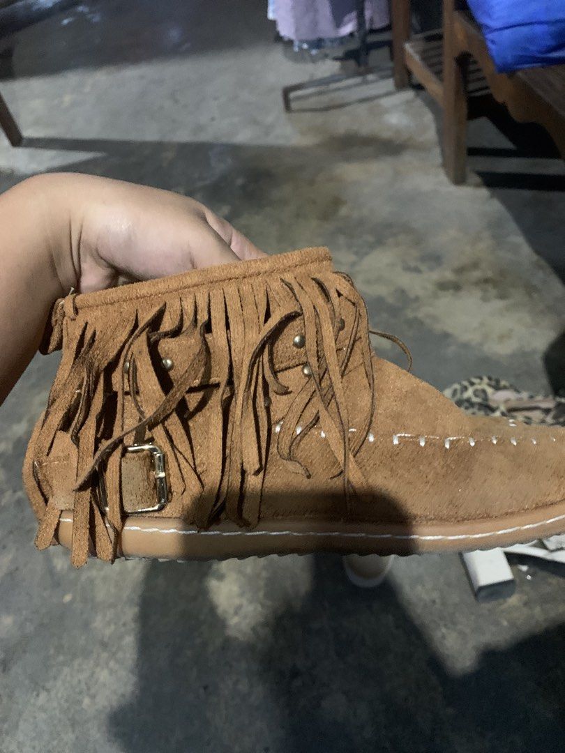 Brown Suede Fringe Ankle Boots (Category: Boots) located in Manila. Submitted by thriftnivee (Listing ID 1463030972, Image 1). Description: - Cute brown suede ankle boots - Fringe detail on the side - Buckle strap accent - Inner zipper closure for easy wear - White stitching detail on the toe - Ideal for casual everyday style.