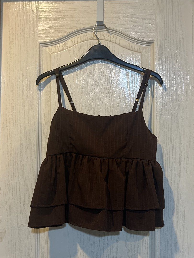 Brown Tiered Camisole Top (Category: Sleeveless) located in Quezon City. Submitted by sunusales (Listing ID 1463023262, Image 1). Description: - Cute brown camisole top - Square neckline with adjustable straps - Smocked bust detail for a flattering fit - Tiered ruffle hemline for a playful look - Versatile: pairs well with jeans or skirts - Ideal for casual outings or dressing up gcash, maribank j&t, sdd (grab/lalamove - to be booked by buyer).
