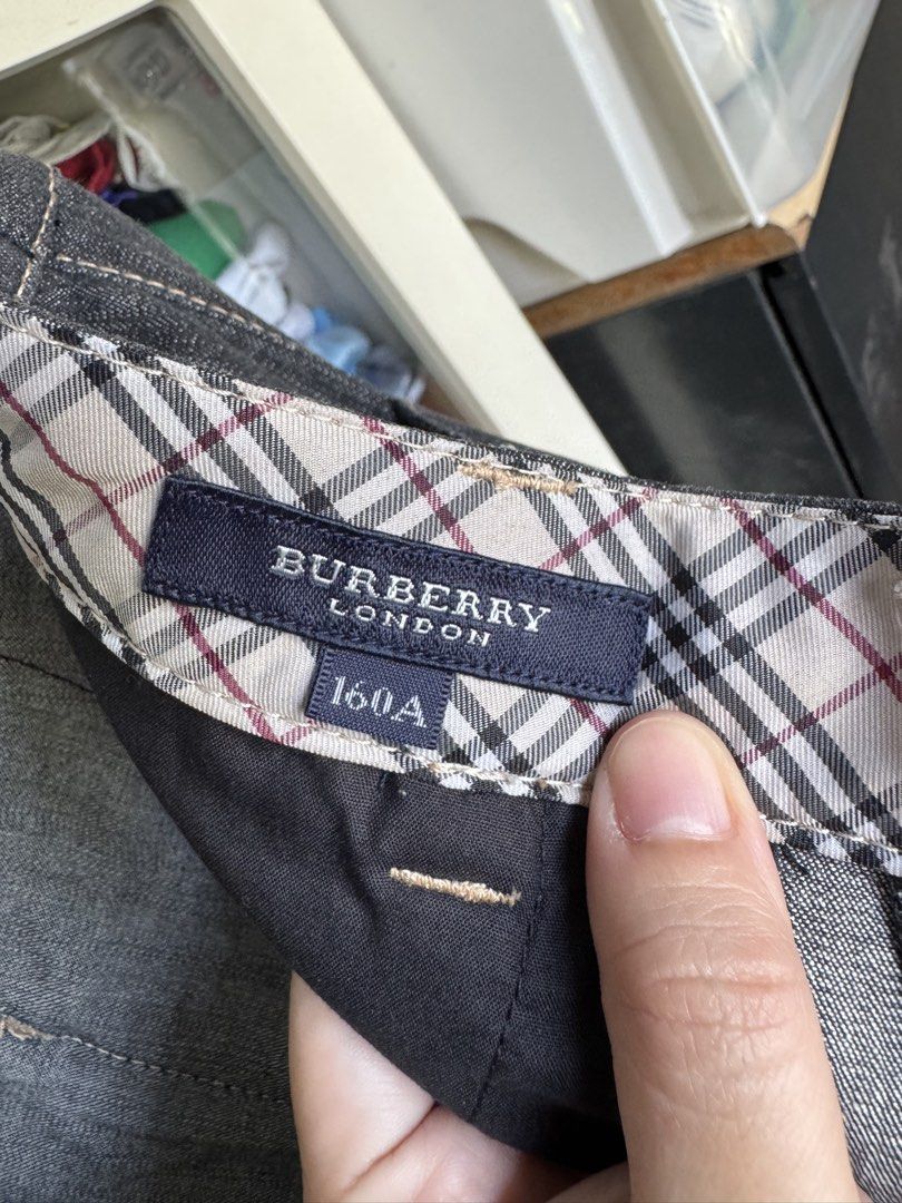 Burberry Capri Jeans (Category: Jeans) located in Mabalacat. Submitted by darkmochafrappe2 (Listing ID 1462907703, Image 2). Description: - Burberry London capri jeans - Size: 160A, may fit adult XS-S - Dark wash denim - Iconic Burberry check lining - Zip fly and button closure - Embroidered Burberry logo on back pocket - Cute tie detail at the hem.