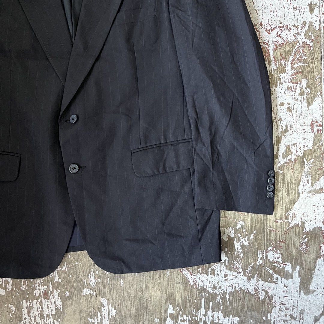 BURBERRY dark gray or black two-button suit jacket with a subtle textured stripe pattern and notched lapels. (Category: Coats, Jackets and Outerwear) located in Iloilo. Submitted by plugsta (Listing ID 1462991606, Image 2). Description: BURBERRY SIZE: M MEASUREMENTS LAID FLAT (IN INCHES): WIDTH: 22 LENGTH: 31 SLEEVE LENGTH: 24 SS: 19 CONDITION: 9/10 FLAW/S: NECKPART .