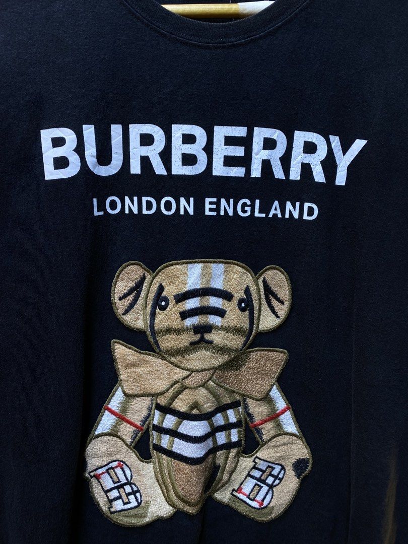 BURBERRY LONDON “Embroid Teddy bear” Tee (Category: Tshirts & Polo Shirts ) located in Makati City. Submitted by drip.poww (Listing ID 1462940368, Image 3). Description: - Burberry - Color: Black - Size: Large - Dimes: 23x26 - Authentic - No side stitch - Excellent condition - Need wash, fresh from bale - Material: 100% Cotton Please don’t expect too much—these are thrifted (ukay) items. 😊 !!STILL NEGOTIABLE!!.