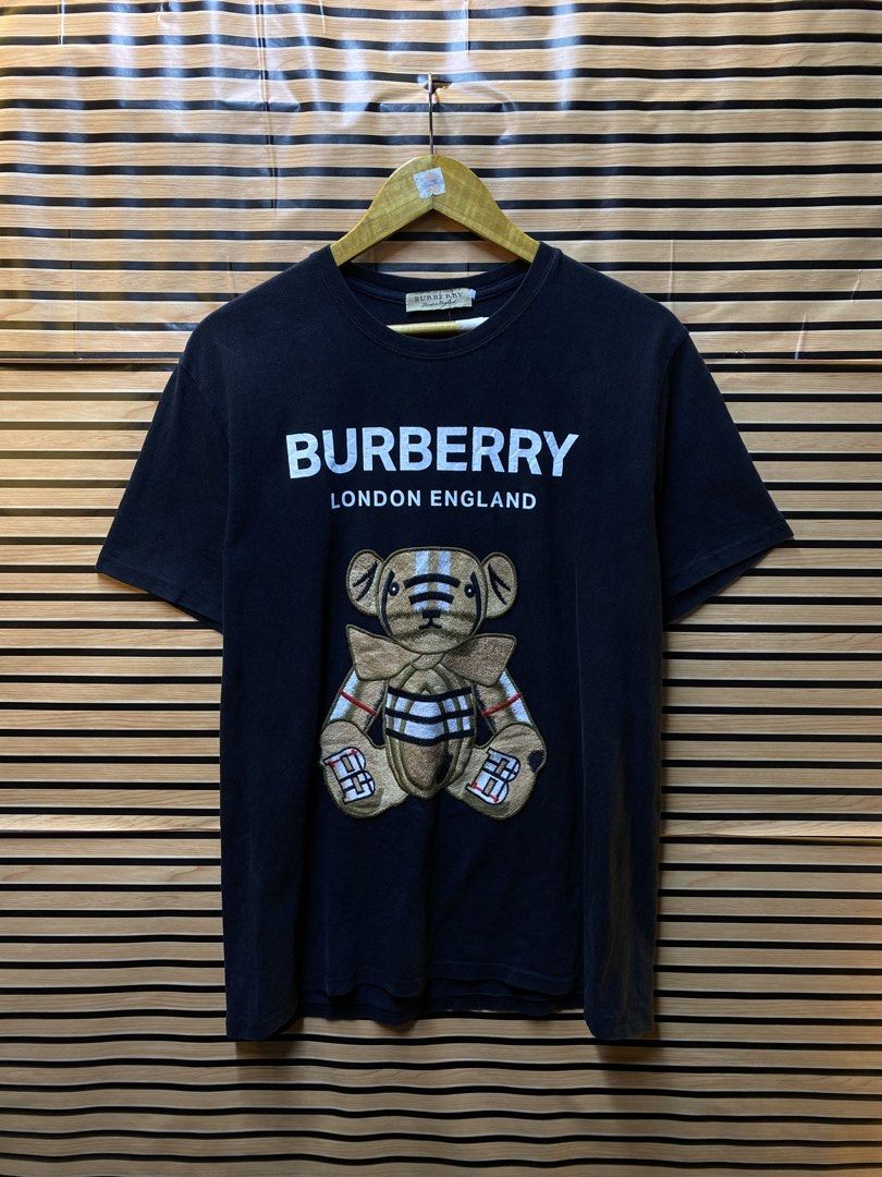 BURBERRY LONDON “Embroid Teddy bear” Tee (Category: Tshirts & Polo Shirts ) located in Makati City. Submitted by drip.poww (Listing ID 1462940368, Image 1). Description: - Burberry - Color: Black - Size: Large - Dimes: 23x26 - Authentic - No side stitch - Excellent condition - Need wash, fresh from bale - Material: 100% Cotton Please don’t expect too much—these are thrifted (ukay) items. 😊 !!STILL NEGOTIABLE!!.