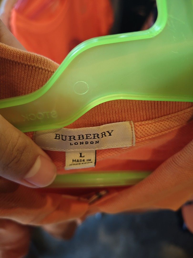 Burberry Orange Polo-shirt (Category: Luxury Apparel) located in Manila. Submitted by rajingg (Listing ID 1462907048, Image 2). Description: -has fade but not really visible -negotiable price -9/10cr -L size.