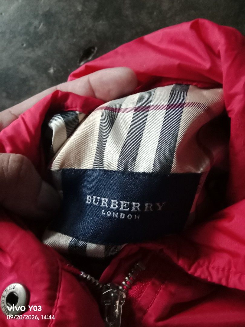 Burberry Pink Lightweight Jacket (Category: Coats, Jackets and Outerwear) located in Cabuyao City. Submitted by blake657 (Listing ID 1462963084, Image 3). Description: - Lightweight pink Burberry jacket - Ideal for layering - Adjustable drawstring waist for a custom fit - Convenient zip pockets on the front - Lined with iconic Burberry check pattern - A versatile and stylish wardrobe essential.