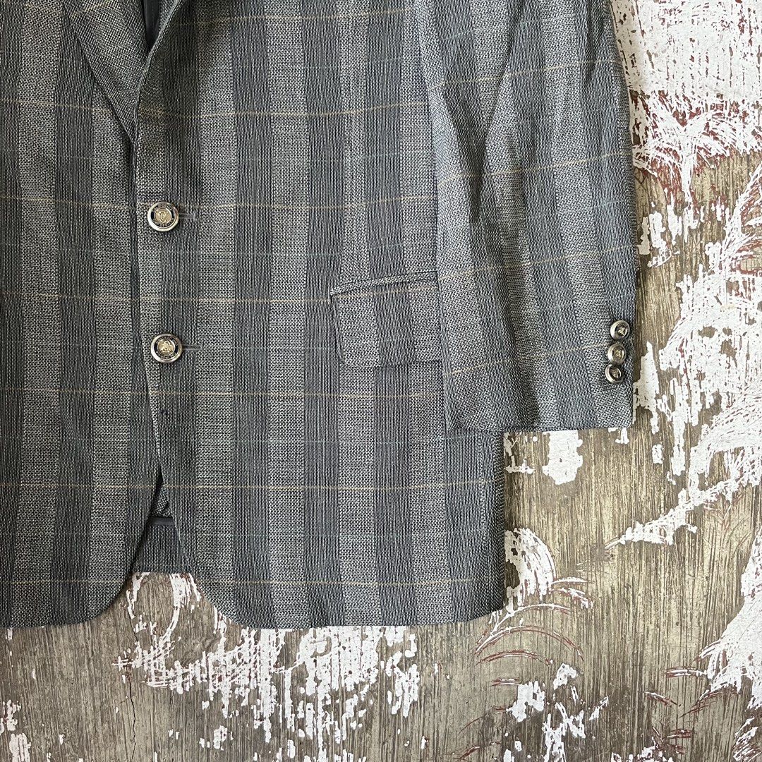 BURBERRYS gray two-button blazer featuring a subtle vertical plaid pattern. (Category: Coats, Jackets and Outerwear) located in Iloilo. Submitted by plugsta (Listing ID 1462993596, Image 2). Description: BURBERRY SIZE: M MEASUREMENTS LAID FLAT (IN INCHES): WIDTH: 20 LENGTH: 28 SLEEVE LENGTH: 20.5 SS: 17 CONDITION: EXCELLENT FLAW/S: NONE.