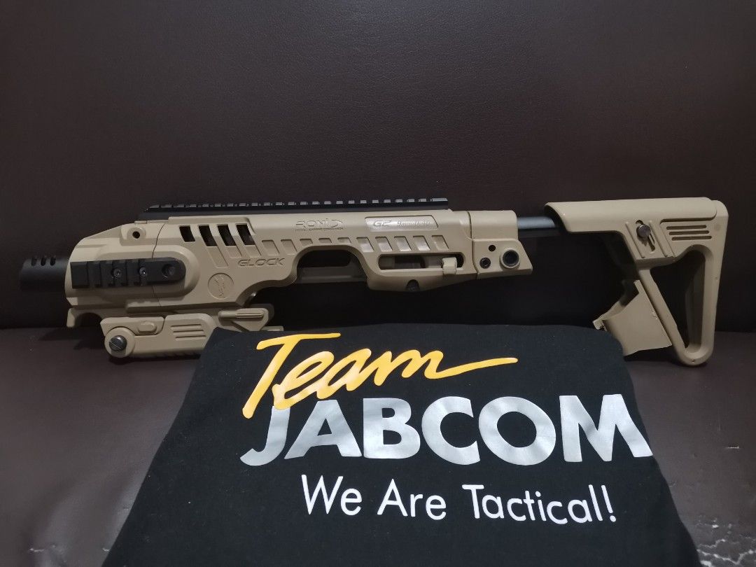 CAA RONI Conversion Kit (Category: Action & Battle Toys) located in Del Monte. Submitted by jabcom_tactical_outfitters (Listing ID 1462932211, Image 2). Description: - Tan Glock conversion kit - Converts your Glock pistol into a carbine - Features rails for accessories - Ideal for tactical setups.