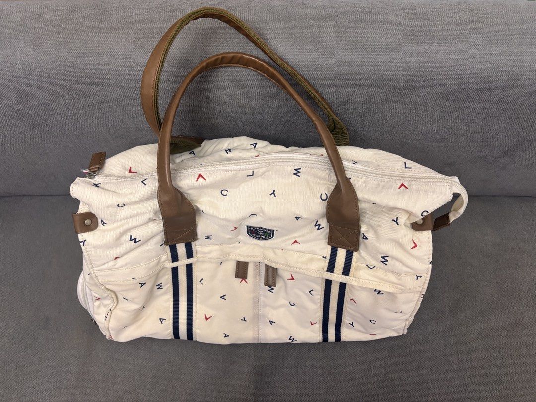 Callaway Golf Duffel Bag Cream Pattern 💯 (Category: Other Sports Equipment and Supplies) located in Quezon City. Submitted by frodo0905 (Listing ID 1463092424, Image 3). Description: - Cream colored duffel bag with a fun, eye-catching pattern. - Features stylish leather handles and trim for a premium feel. - Multiple exterior pockets for easy access to essentials. - Vibrant bright pink interior lining adds a pop of color. - Ideal size for weeken