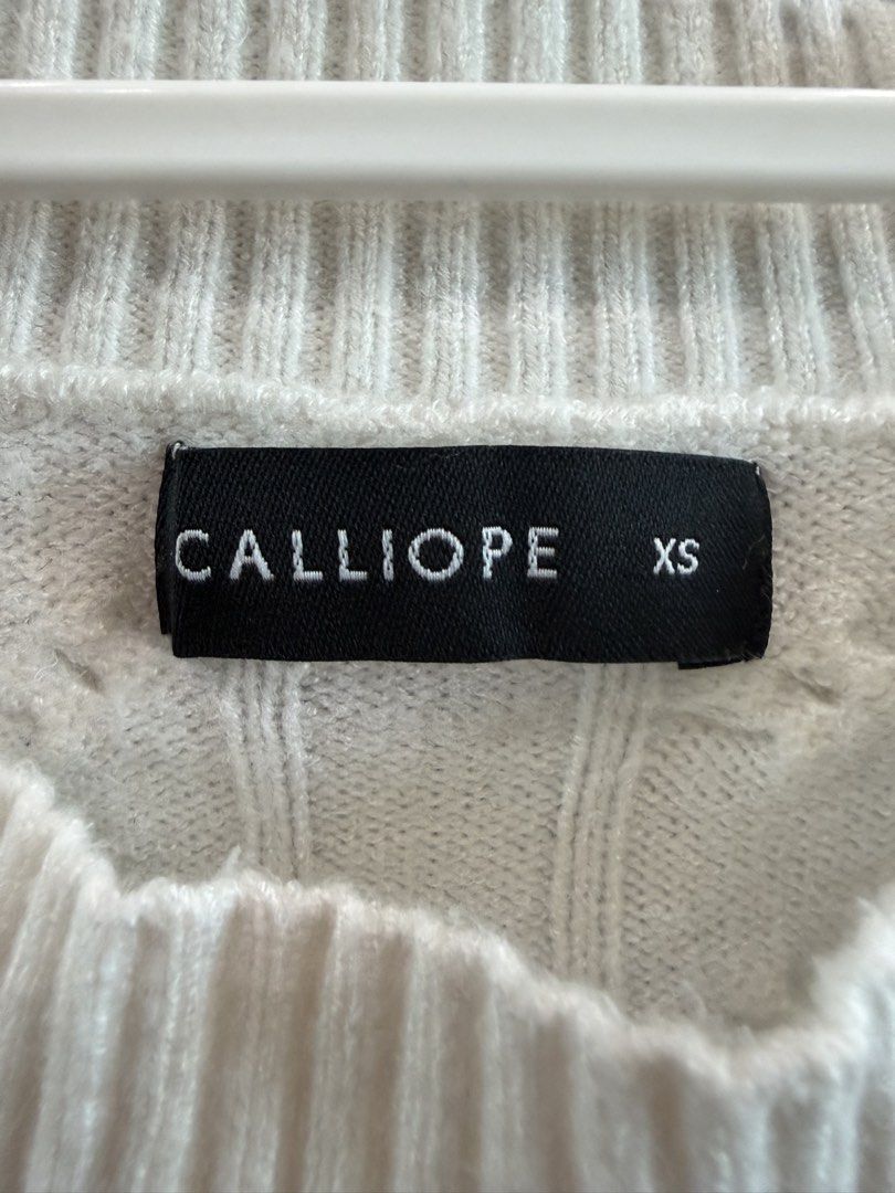 Calliope White Knit Sweater XS (Category: Longsleeves) located in Makati City. Submitted by melaitan (Listing ID 1462923409, Image 1). Description: - White knit sweater from Calliope - Size XS - Features a ribbed texture throughout - Cozy and comfortable feel - Ideal for layering or wearing solo - Perfect for cooler weather.