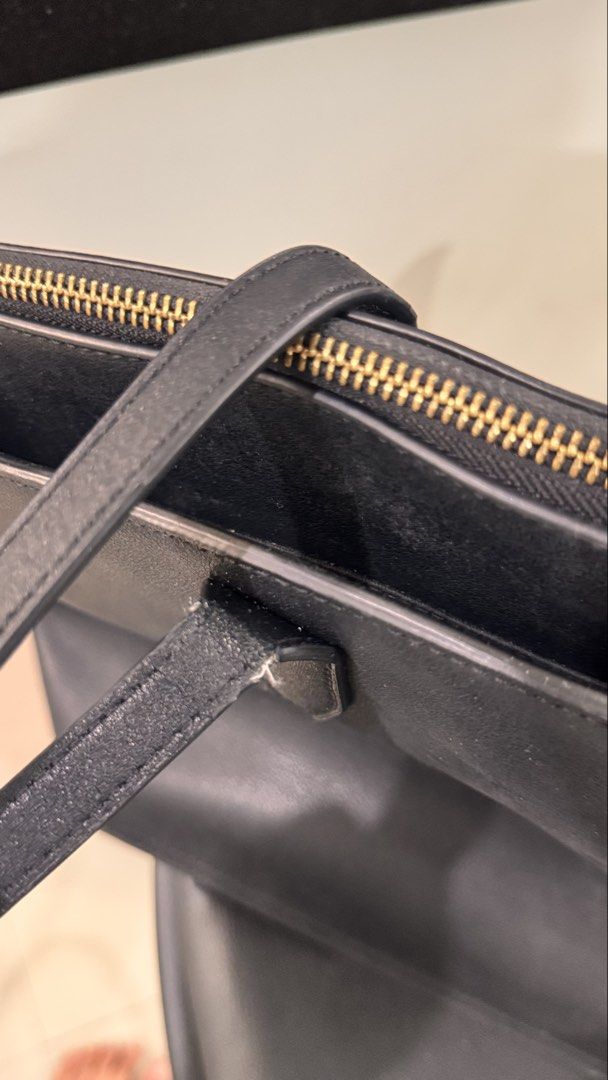 Calvin Klein Medium Dome Leather Tote Bag (Category: Tote Bags) located in Makati City. Submitted by forg3d_paradox (Listing ID 1462999909, Image 3). Description: 🌟 Preloved with no Major Defects but shows signs of usage. 🌟classic and minimalist tote bag made with faux leather material and gold hardware. 🌟 with flat double, non-adjustable top shoulder handles. 🌟 good for school and office use. It can fit a 13-inch laptop. .