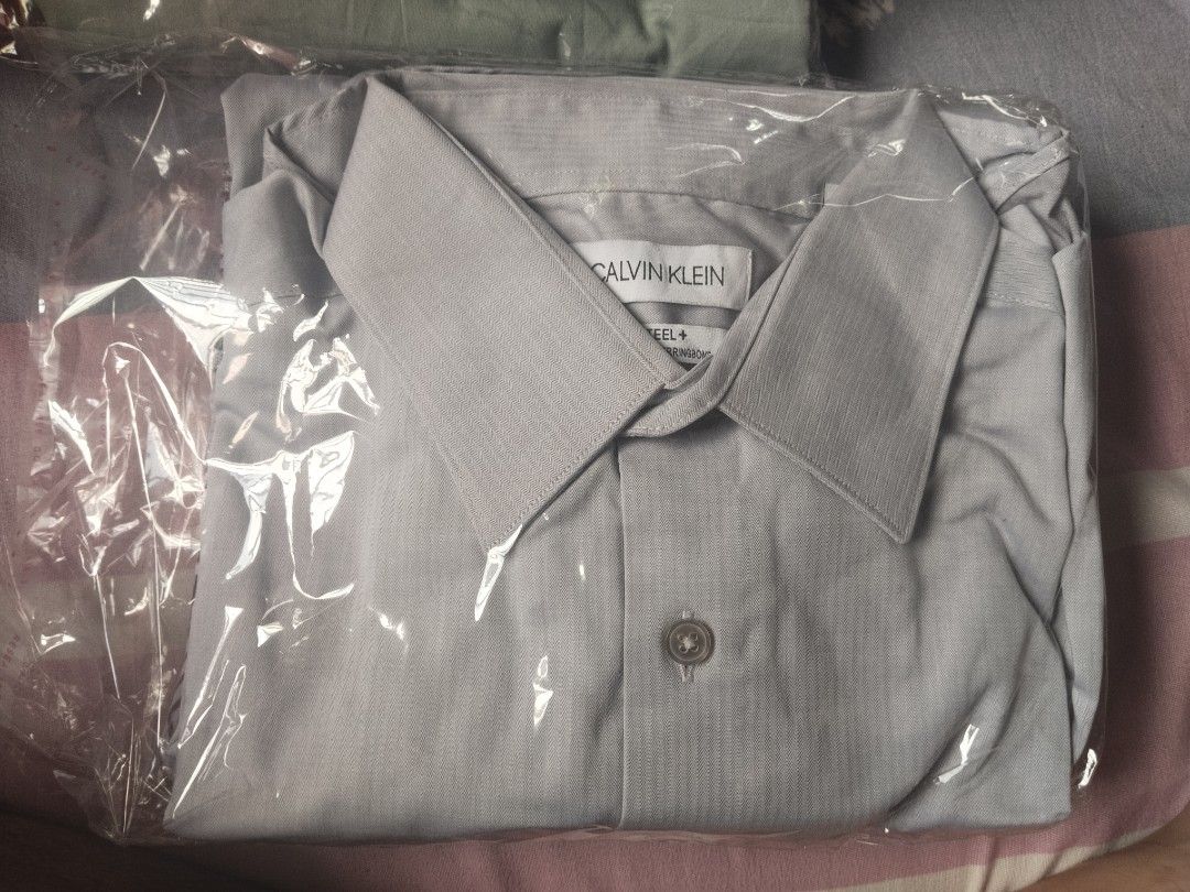 Calvin Klein Steel+ Herringbone long sleeve (Category: Dresses) located in Manila. Submitted by juanayesha1713 (Listing ID 1462967245, Image 1). Description: - Brand: Calvin Klein - Model: Steel+ - Pattern: Herringbone - Style: Button-up dress shirt - Condition: Brand new, in original packaging - Occasion: Ideal for work or smart casual events.