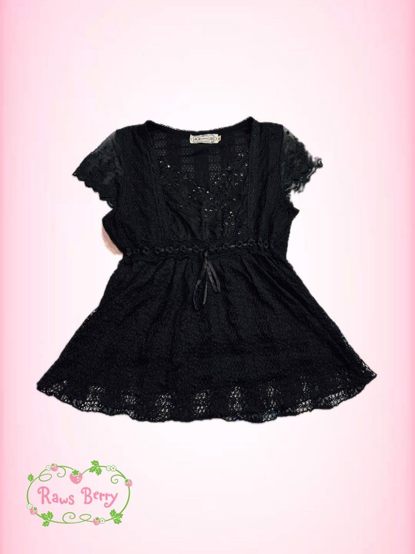 Calypso Black Lace Sequin V-Neck Top (Category: Blouses) located in Adams. Submitted by raws_berrycheesecake (Listing ID 1463046341, Image 1). Description: - Elegant black lace top - Features shimmering sequin details - Flattering V-neckline - Comfortable short sleeves - Adjustable drawstring waist for a customized fit - Delicate lace trim on hem and sleeves - Tag indicates size M - Versatile for layering or wearing as a standalone piece .