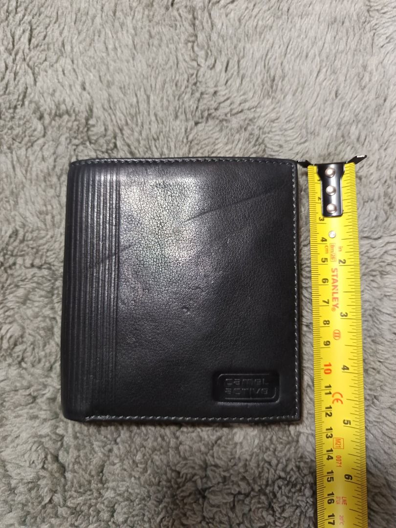 Camel Active Leather Trifold Wallet (Category: Wallets & Card Holders) located in Baguio. Submitted by cracklin.aniue26 (Listing ID 1463018141, Image 3). Description: - Brand: Camel Active - Material: Black Leather - Style: Trifold Wallet *Embossed camel Logo on the bottom right *Camel logo on top of the coin pouch cover *Custom woven interior fabric lining featuring camel silhouette logo motif *Genuine leather stamp - Layout and Storage Features