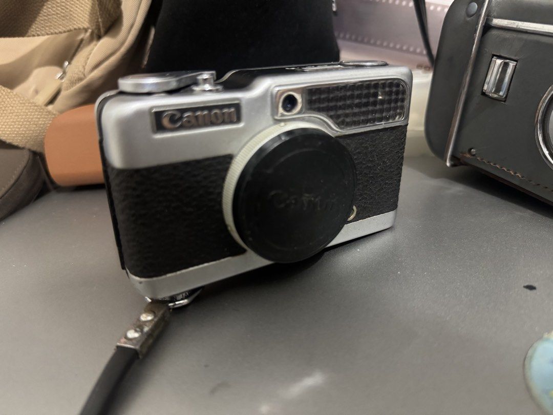 Canon Demi Half Frame 35mm Film Camera (Category: Cameras) located in Pasay City. Submitted by anne__alog (Listing ID 1463066041, Image 3). Description: - Vintage Canon Demi half-frame 35mm film camera - Sleek silver and black design - All features are working (light meter, shutter, advance lever) - Comes with original canon strap and lens cap - Film tested. Please note that film used was expired and storage of said film was unknown. This is why 