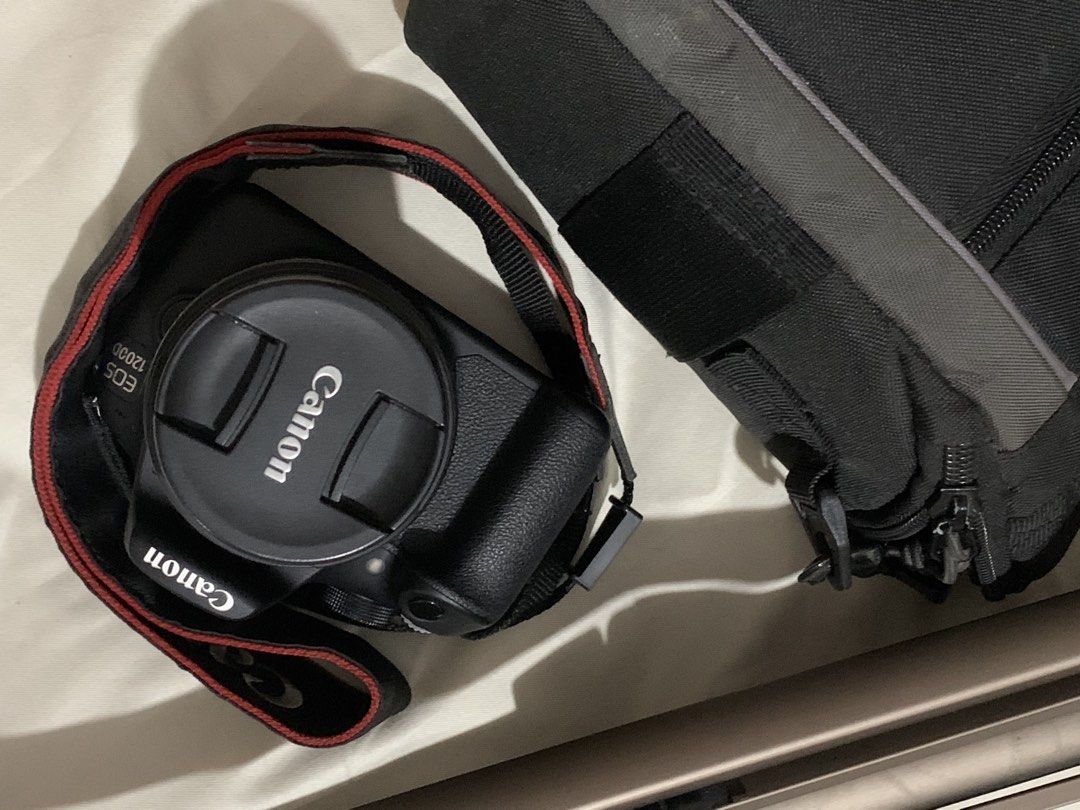 CANON EOS 1200D DSLR CAMERA (Category: Cameras) located in San Pedro. Submitted by mlbdll (Listing ID 1462933673, Image 2). Description: CANON EOS 1200D DSLR CAMERA • Ideal for beginners and hobbyists • Comes with original strap • Screen displays settings (ISO, aperture, shutter speed) RFS: Not using anymore INCLUSIONS: • Canon EOS 1200D body • Canon EF-S 18-55mm lens + cover • Camera Bag • Battery + Charger • Tripod CONDITION / DISCLOSURE: • Len