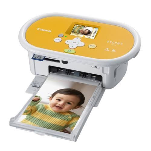Canon SELPHY CP775 Compact Photo Printer (Category: Printers, Scanners & Copiers) located in Manila. Submitted by prelovedshop0818 (Listing ID 1463065974, Image 2). Description: - Canon SELPHY CP775 photo printer - Compact and portable with a yellow top and built-in handle - Easy operation via small screen and buttons - Direct printing from memory cards - Includes power cord and other accessories.