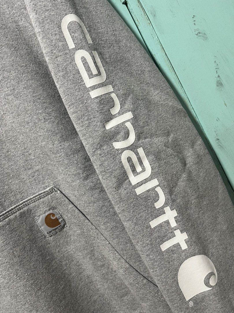 Carhartt K228 HGY Hoodie - Medium (Category: Coats, Jackets and Outerwear) located in Malaybalay. Submitted by tapiocasthrift (Listing ID 1462995645, Image 2). Description: Size: Medium Dimes: 23.5x29.5 Color rate: 9.5/10 Color may vary due to lighting Excellent condition Issue: very minor scratch text necktag.