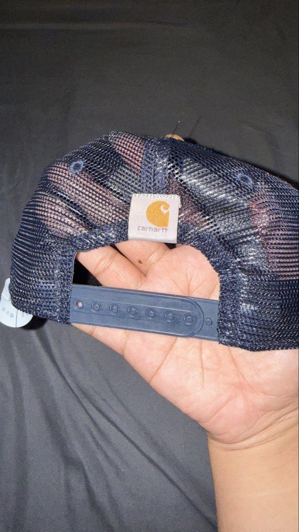 Carhartt Trucker Cap - Brown, Navy, Mesh Back (Category: Caps & Hats) located in Manila. Submitted by nobleangel (Listing ID 1462921436, Image 2). Description: - Classic Carhartt trucker cap - Brown front panels with navy brim and mesh back - Features iconic Carhartt logo patch on the front - Adjustable snapback for a comfortable, custom fit - Ideal for everyday style and sun protection.