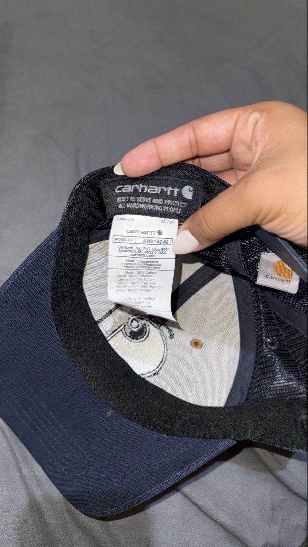 Carhartt Trucker Cap - Brown, Navy, Mesh Back (Category: Caps & Hats) located in Manila. Submitted by nobleangel (Listing ID 1462921436, Image 3). Description: - Classic Carhartt trucker cap - Brown front panels with navy brim and mesh back - Features iconic Carhartt logo patch on the front - Adjustable snapback for a comfortable, custom fit - Ideal for everyday style and sun protection.