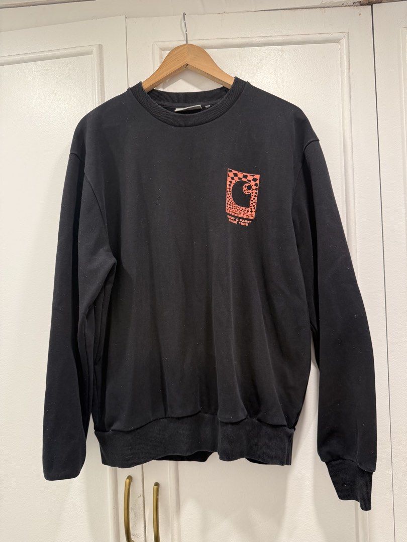 Carhartt Work In Progress Black Sweatshirt Size M (Category: Coats, Jackets and Outerwear) located in Pasig City. Submitted by helpmedispose (Listing ID 1462988367, Image 3). Description: - Brand: Carhartt - Color: Black - Size: Medium (M) - Design: Graphic print on the chest - Features: Ribbed cuffs and hem - Style: Ideal for casual wear.