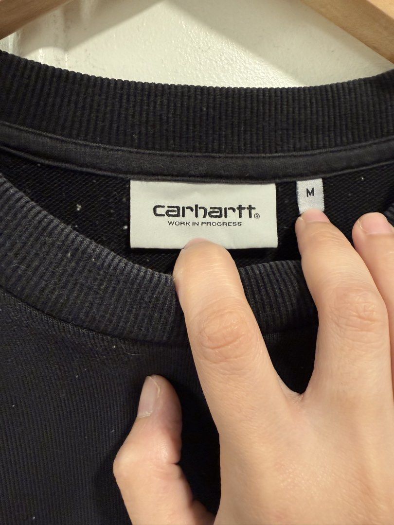Carhartt Work In Progress Black Sweatshirt Size M (Category: Coats, Jackets and Outerwear) located in Pasig City. Submitted by helpmedispose (Listing ID 1462988367, Image 2). Description: - Brand: Carhartt - Color: Black - Size: Medium (M) - Design: Graphic print on the chest - Features: Ribbed cuffs and hem - Style: Ideal for casual wear.