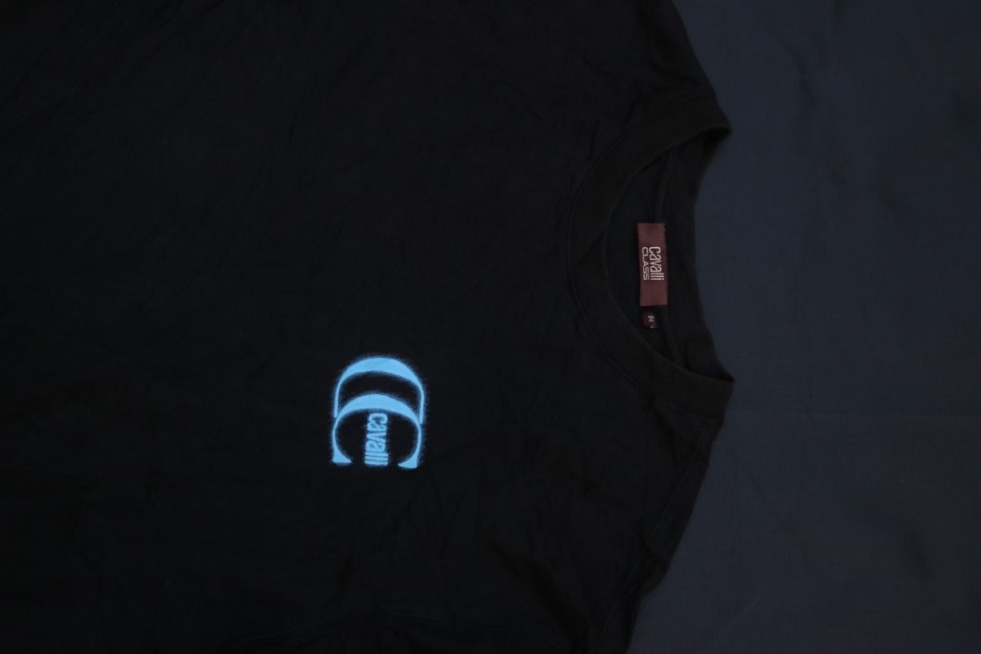 Cavalli Class Black T-Shirt with Blue Logo (Category: Tshirts & Polo Shirts ) located in Taguig. Submitted by kurim4w (Listing ID 1463008775, Image 2). Description: - Cavalli Class black t-shirt - Features signature blue logo on chest and back - Made from comfortable fabric - Ideal for casual wear - Brand new with tags still attached - have some discoloration in neck 22width 30length authentic 350php plus sf only taguig city location .