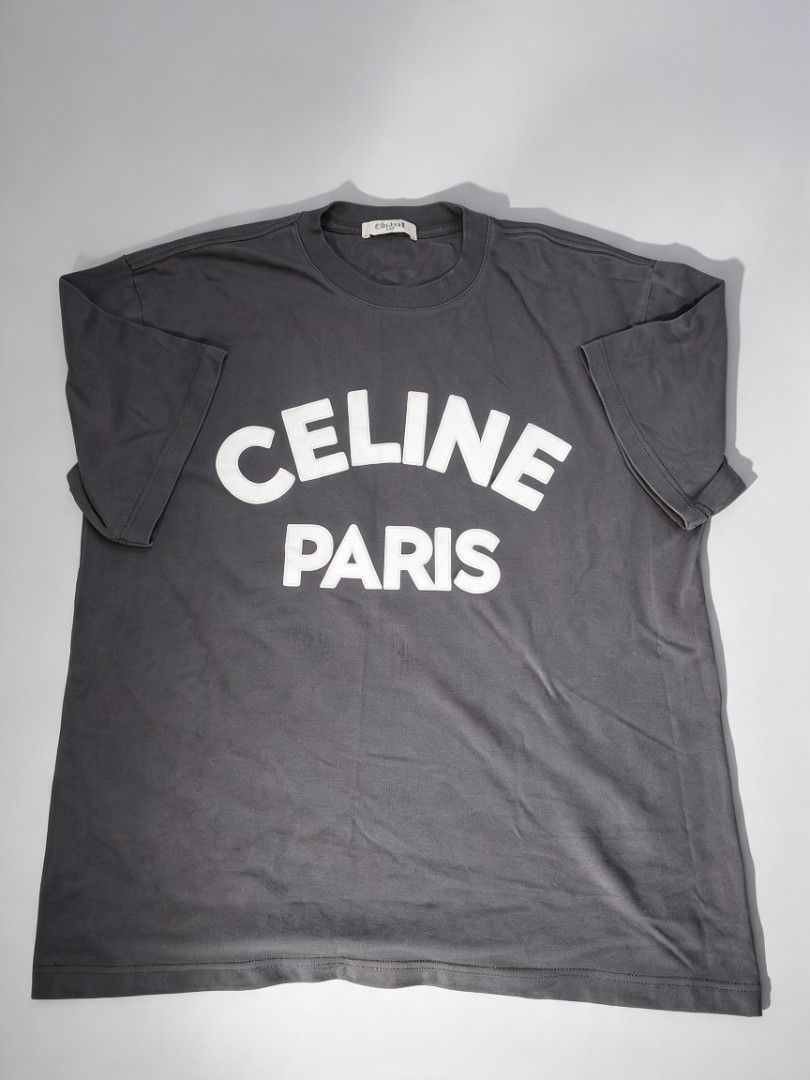 Celine Paris T-shirt (Category: Shirts) located in Manila. Submitted by thrift_for_good (Listing ID 1462982254, Image 1). Description: - Grey Celine Paris T-shirt - Short sleeves - Crew neck - Simple and classic design - Ideal for casual wear - Please check photos for detailed condition.