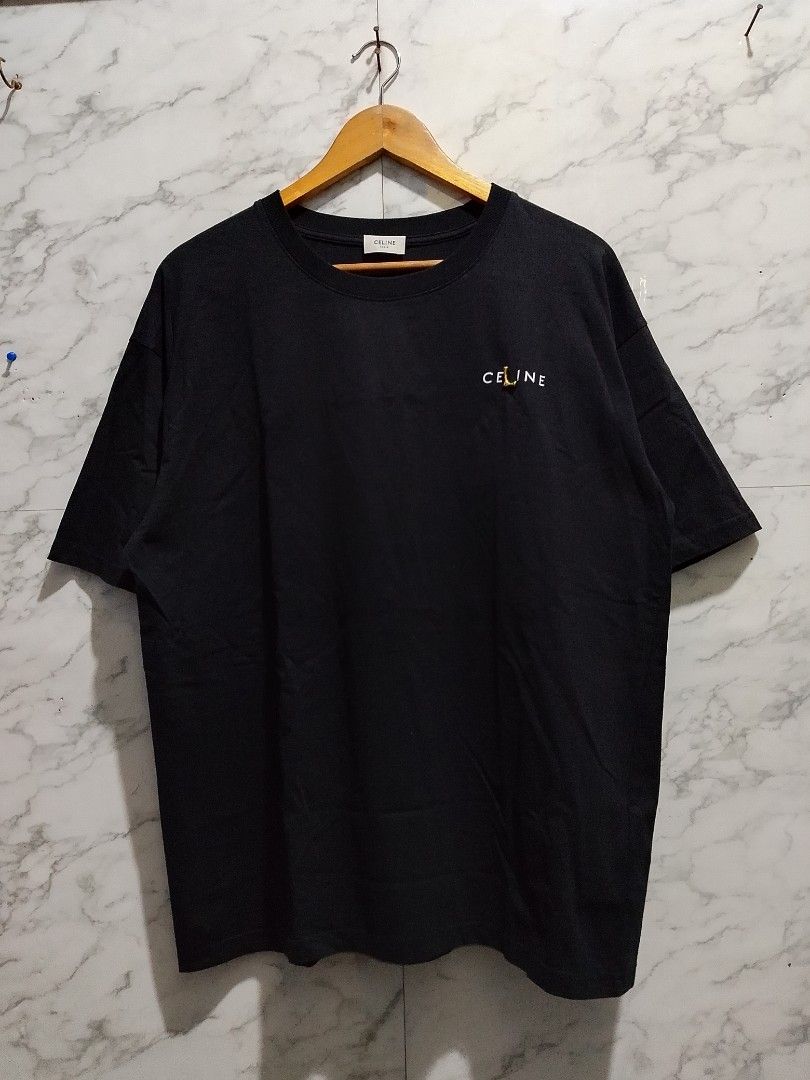 Celine Spellout T-shirt (Category: Tshirts & Polo Shirts ) located in Paranaque City. Submitted by lanceee.999 (Listing ID 1462935599, Image 1). Description: Size: M Dimes: W23 L29 Complete Tags Off/Authentic No Issue Color Rate: 9/10 Good Condition.