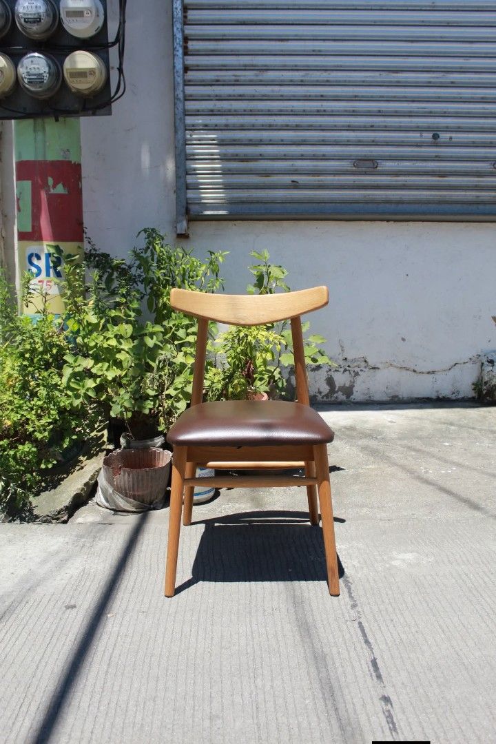 Chair (Category: Chairs) located in Meycauayan. Submitted by marygracecasimiro (Listing ID 1463068496, Image 3). Description: Mid-Century Modern Wooden Dining Chair Curved backrest, natural light wood finish, sturdy tapered legs and a comfortable padded seat upholstered in dark brown leather. Perfect for dining areas, modern homes or minimalist interiors L:17 • W:20 • Seat H:17 ½ • Back H:31 inches 2,900 pesos only🩷.