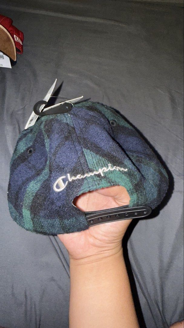 Champion Plaid Snapback Cap (Category: Caps & Hats) located in Manila. Submitted by nobleangel (Listing ID 1462920985, Image 2). Description: - Champion snapback cap - Green and navy plaid pattern - Embroidered Champion logo on front and back - Adjustable strap for a custom fit - Made in China.