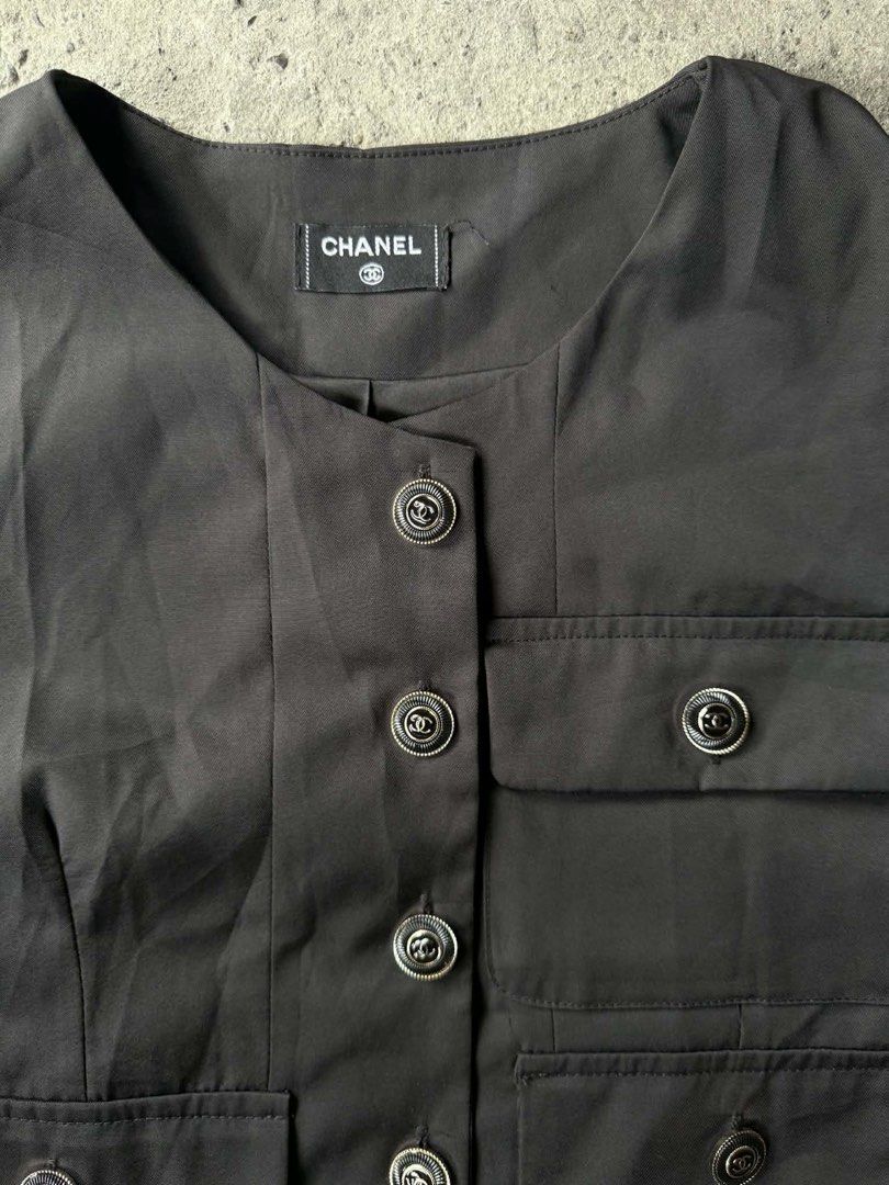 Chanel Black Cropped Jacket with Button Detail (Category: Coats, Jackets and Outerwear) located in Manila. Submitted by luckyhorse.f804d6 (Listing ID 1462885768, Image 2). Description: - Authentic Chanel cropped jacket - Color: Black - Design: Short sleeves, round neckline - Features: Four front pockets, button closure - Details: Buttons with Chanel logo - Versatile: Ideal for layering or wearing on its own.