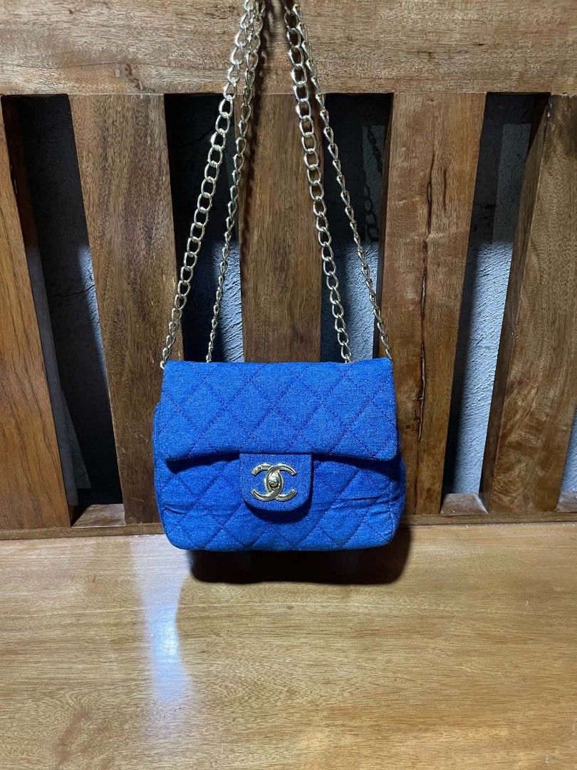 Chanel Blue Quilted Flap Bag (Category: Luxury Bags & Wallets) located in Pangantucan. Submitted by calmwhale_cb83a8 (Listing ID 1462997163, Image 1). Description: - Blue Chanel flap bag - Quilted design - Gold CC logo clasp - Interior zippered pocket - Gold chain strap - Adds a pop of color to any look.