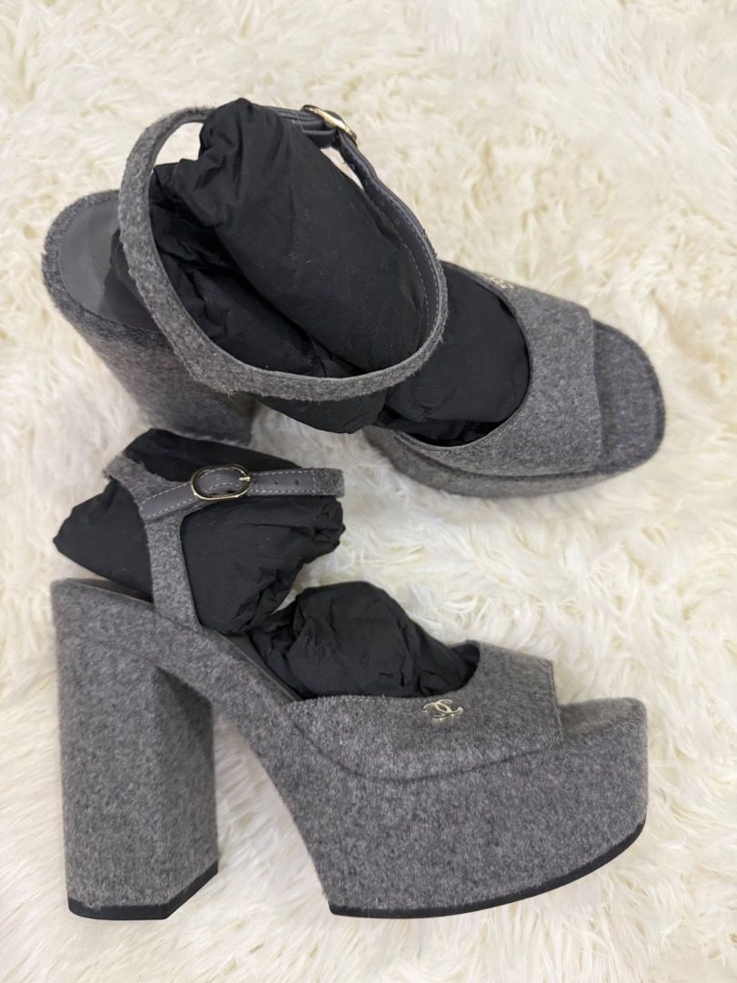 Chanel Grey Felt Platform Sandals Size 39 (Category: Sandals) located in Quezon City. Submitted by ilabluxe (Listing ID 1462939209, Image 2). Description: - Authentic Chanel grey felt platform sandals - Size: 39 - Features: Ankle strap, chunky block heel - Condition: Comes with original box - Style: Perfect for dressing up or down 100% Authentic or Money Back Guarantee.