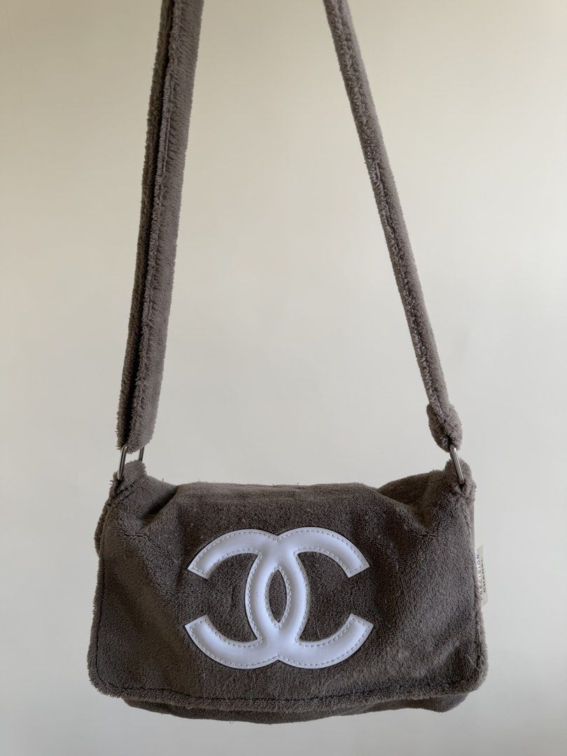 Chanel Grey Terrycloth Shoulder Bag (Category: Luxury Bags & Wallets) located in Bacolor. Submitted by ieshaaa.1 (Listing ID 1462892566, Image 1). Description: - Grey terrycloth shoulder bag - Iconic white Chanel CC logo - Secure zipper closure - Smooth satin-like interior lining - Comes with authenticity tag - Ideal for everyday use.