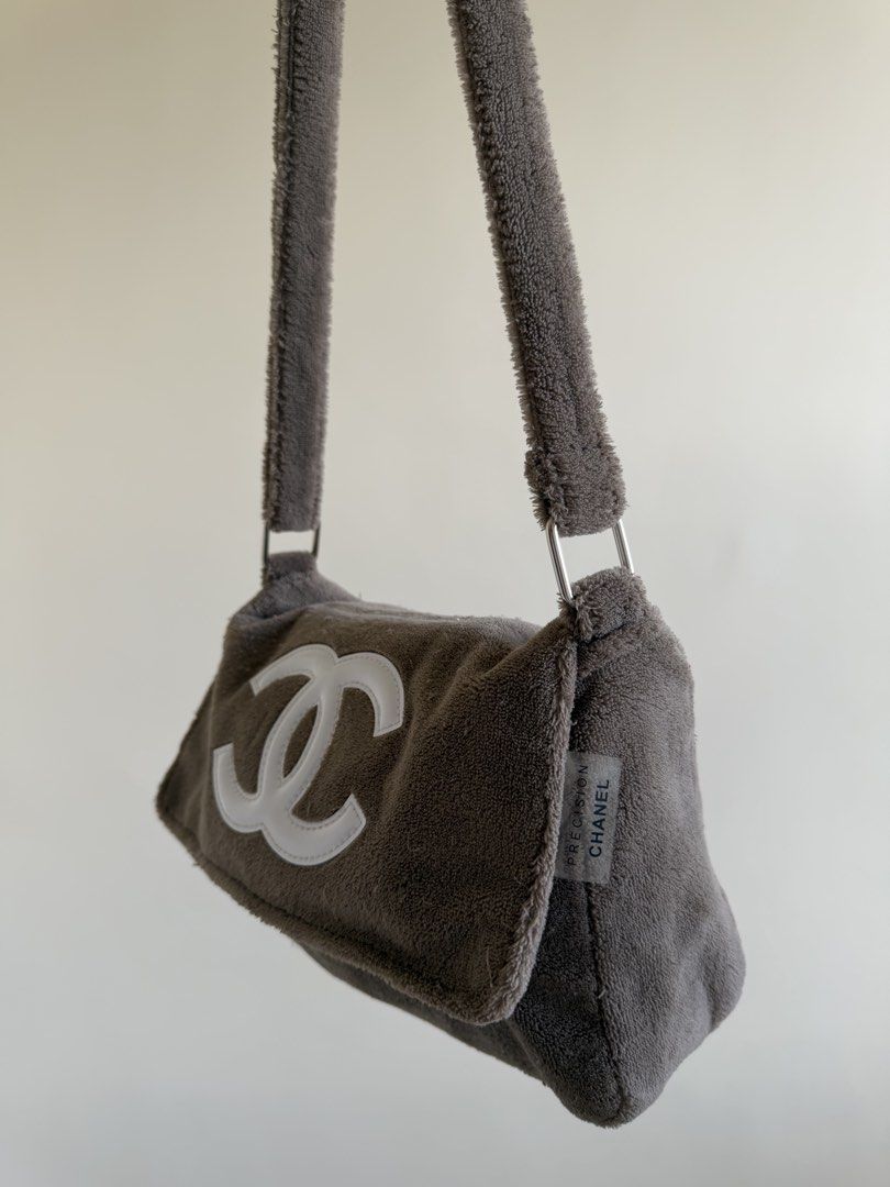 Chanel Grey Terrycloth Shoulder Bag (Category: Luxury Bags & Wallets) located in Bacolor. Submitted by ieshaaa.1 (Listing ID 1462892566, Image 2). Description: - Grey terrycloth shoulder bag - Iconic white Chanel CC logo - Secure zipper closure - Smooth satin-like interior lining - Comes with authenticity tag - Ideal for everyday use.