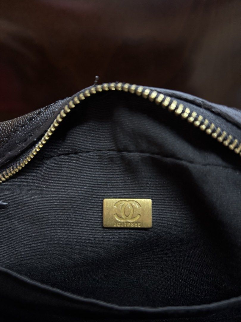 Chanel Quilted Black Leather Top Handle Bag with Strap (Category: Luxury Bags & Wallets) located in Manila. Submitted by robbyrabbit (Listing ID 1462919805, Image 2). Description: - Black quilted leather handbag - Iconic CC logo on the front - Decorative strap included - Secure zipper closure - Interior serial number plate - Versatile for daily use or special events.