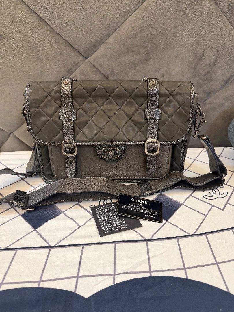 Chanel Quilted Leather Messenger Bag (Category: Luxury Bags & Wallets) located in Caloocan City. Submitted by piamariemo11606 (Listing ID 1463040704, Image 1). Description: - Authentic Chanel Messenger Bag - Color: Dark Grey - Material: Quilted Leather - Hardware: Silver - Features: Adjustable shoulder strap, interior zip pocket - Includes: Authenticity card - Serial number visible in photos.