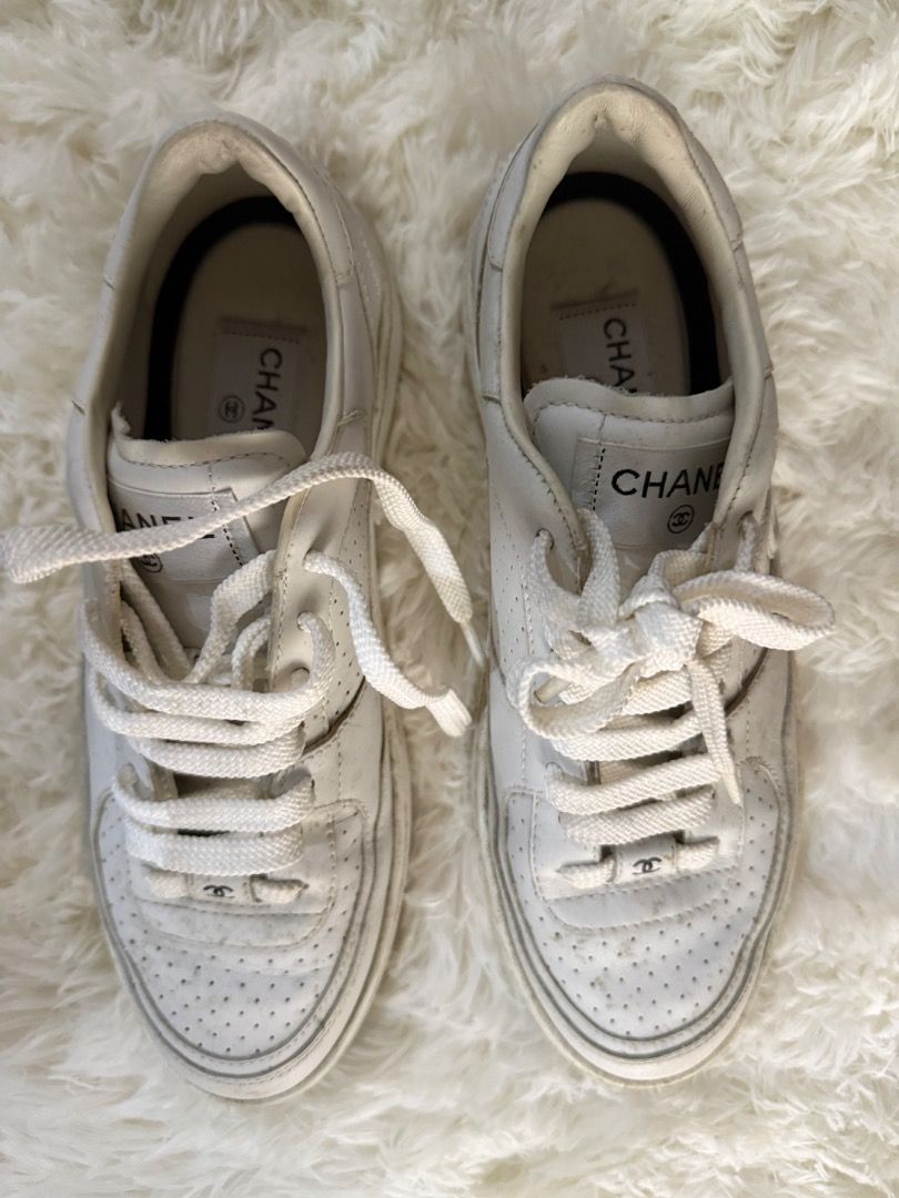 Chanel White Leather CC Logo Sneakers (Category: Sneakers) located in Quezon City. Submitted by ilabluxe (Listing ID 1462894881, Image 2). Description: - Authentic Chanel sneakers - will fit size 38 womens - White leather with iconic CC logo - Perforated toe box detail - White laces - Interior Chanel branding - Model number: W G45079 - just used once because a little small for me 100% Authentic or money back guarantee.