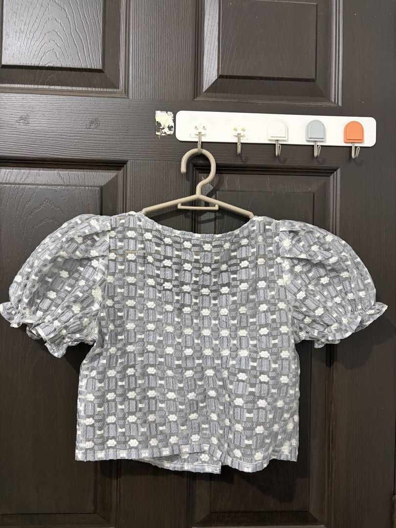Chao Ming Zhen Puff Sleeve Button Up Top (Category: Blouses) located in Pasig City. Submitted by carissuh99 (Listing ID 1463015950, Image 2). Description: - Stylish grey and white patterned puff sleeve top. - Elegant square neckline with button details. - Short sleeves with charming ruffled cuffs. - Made from a lightweight and airy fabric. - Perfect for casual outings or dressing up for a night out..