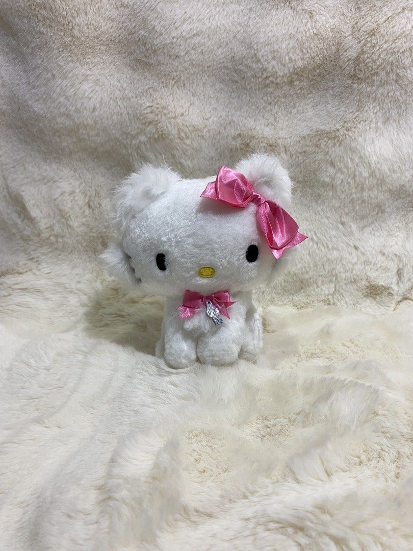 charmmy Kitty plush charm (Category: Plushies & Soft Toys) located in Kalibo. Submitted by ollie_stuffshop (Listing ID 1463076886, Image 1). Description: Before you send your inquiries: ❗️Last Price is already posted ❗️Manage your expectations, WYSIWYG ❗️May need washing ❗️Dropoff is every Wednesday & Sunday - Adorable Charmmy Kitty plush toy - Features a prominent pink bow on its head - Includes a smaller pink bow around its neck - A delicate si