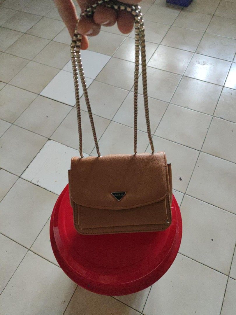 Cheer Rose Small Shoulder / Crossbody Bag (Category: Cross-body Bags) located in Manila. Submitted by warmshark.1ae1ea (Listing ID 1462971885, Image 2). Description: Cheer Rose Small Shoulder / Crossbody Bag – ₱450 Brand: Cheer Rose Brown / tan color Silver-tone chain strap Snap-button closure Front flap pocket Interior compartments Pre-loved condition Minor signs of use, see photos.