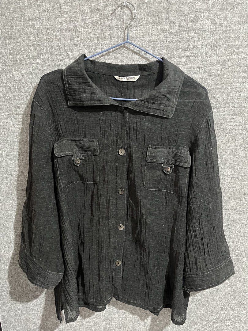 Cher Square Dark Grey Crinkled Button-Up Blouse (Category: Shirts) located in Marikina City. Submitted by femmeshoppemnl (Listing ID 1462937252, Image 2). Description: Cher Square Dark Grey Crinkled Button-Up Blouse Size: 2XL-3XL Condition: Used. See through. With working pockets. Issue: Minimal removable lints Brand: Cher Square Ukay sourced. Washed - Ready to wear. .