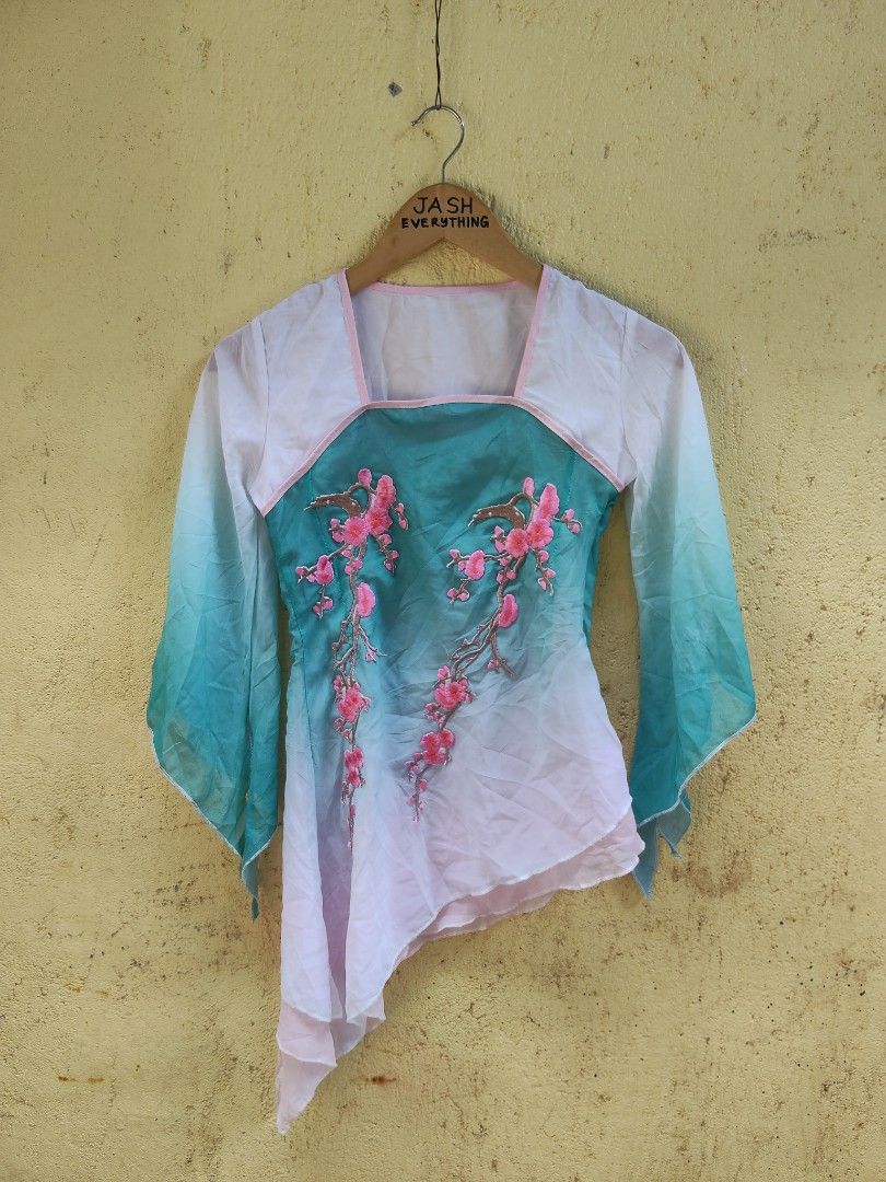 Chinese Style Embroidered Top with Cherry Blossoms (Category: Blouses) located in City of Isabela. Submitted by jasheverything (Listing ID 1462893795, Image 1). Description: - Gradient teal and white color - Intricate pink cherry blossom embroidery on the front - Wide and flowy sleeves - Unique asymmetrical hemline - Versatile for special occasions or stylish everyday looks Excellent Condition Issue Cuttag Small to Med 850+SF.