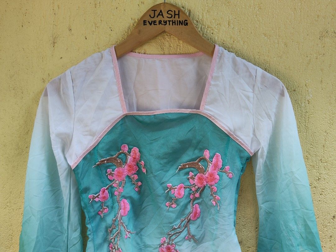 Chinese Style Embroidered Top with Cherry Blossoms (Category: Blouses) located in City of Isabela. Submitted by jasheverything (Listing ID 1462893795, Image 2). Description: - Gradient teal and white color - Intricate pink cherry blossom embroidery on the front - Wide and flowy sleeves - Unique asymmetrical hemline - Versatile for special occasions or stylish everyday looks Excellent Condition Issue Cuttag Small to Med 850+SF.
