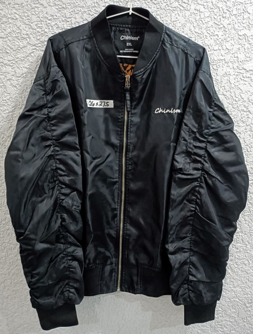 CHINISM BOMBER JACKET (Category: Coats, Jackets and Outerwear) located in Calamba. Submitted by rootsph (Listing ID 1462986860, Image 1). Description: Details: Fits 2XL to 3XL Dimes: 26W x 27.5L Color: Black Condition: Very good, print at the back has slight chipping, complete tags Please manage your expectation, item being sold is preloved and not brand new unless stated otherwise. Major and minor issues will be declared. Signs of usage and pres