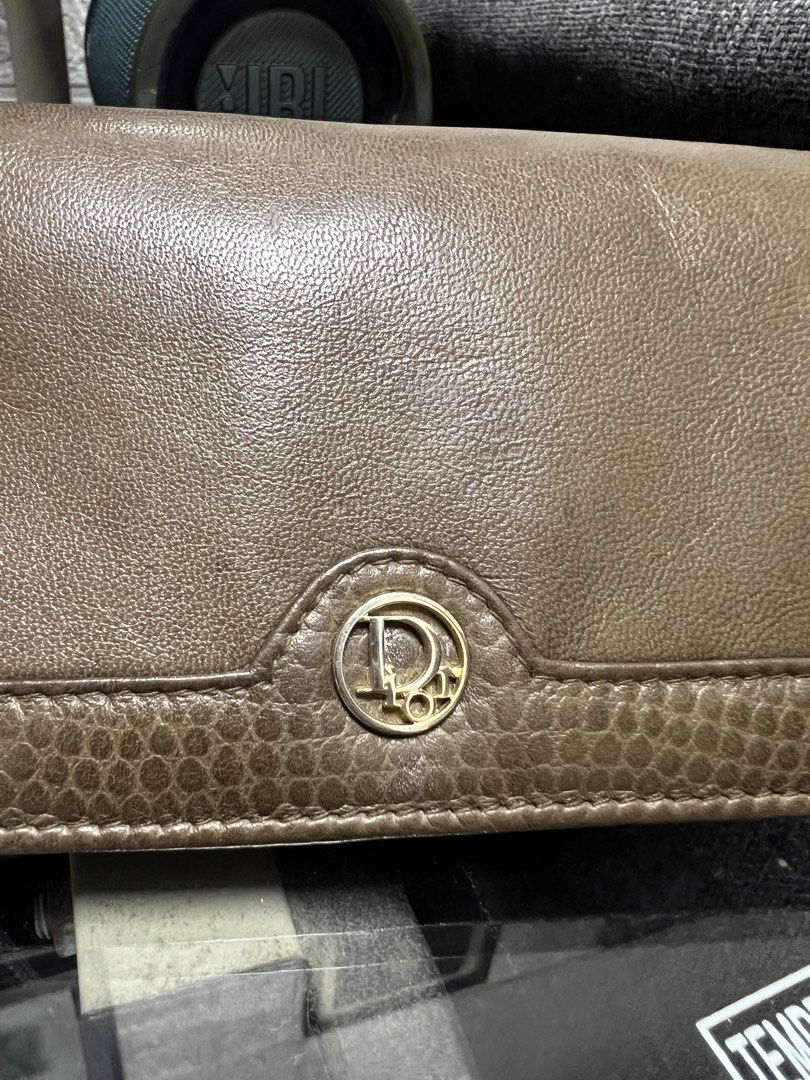 Christian Dior Brown Leather Wallet (Category: Luxury Bags & Wallets) located in General Trias. Submitted by mybag2025 (Listing ID 1463019220, Image 2). Description: - Authentic Christian Dior brown leather wallet - Iconic CD logo on the front - Multiple card slots inside - Zippered compartment for security - Classic and versatile design for everyday use - Shows some signs of wear, but fully functional.