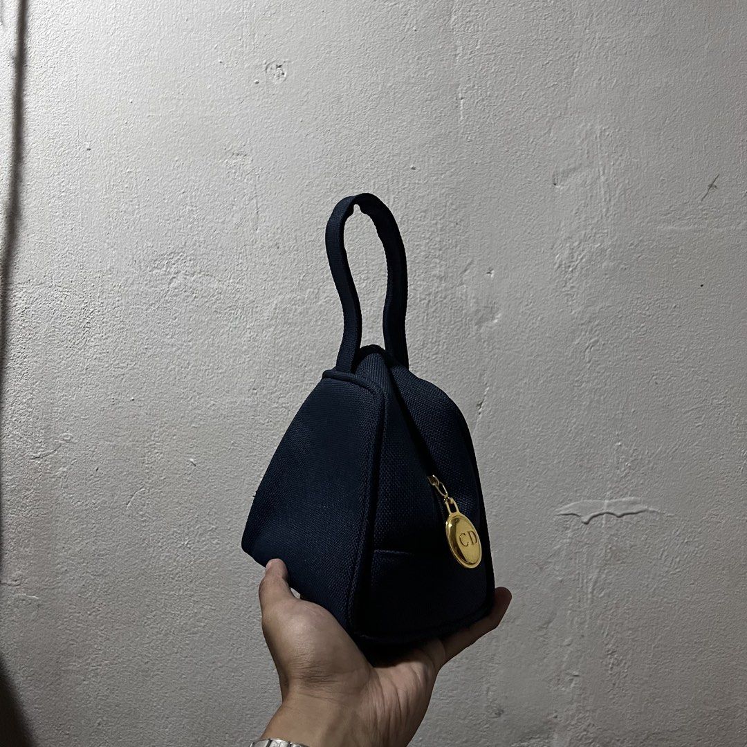 Christian Dior CD Monogram Navy Cosmetic Bag Pouch (Category: Luxury Bags & Wallets) located in San Fernando. Submitted by jebeanjebb (Listing ID 1463035304, Image 1). Description: Authentic Christian Dior makeup pouch. Navy blue CD zipper closure. Perfect for makeup or essentials. Excellent condition Details already posted ₱1,000 + shipping fee Location: San Fernando City La Union I do shipping nationwide 📦✈️.