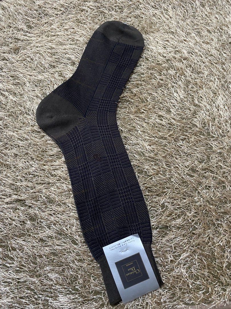 Christian Dior Men's Socks - Plaid Pattern (Category: Socks) located in Bulacan. Submitted by rich2545 (Listing ID 1462900911, Image 2). Description: - Authentic Christian Dior socks - Classic plaid design (dark brown & navy) - Comfortable ribbed cuff - Made with quality materials - Versatile for formal or casual wear - Adds a touch of luxury.